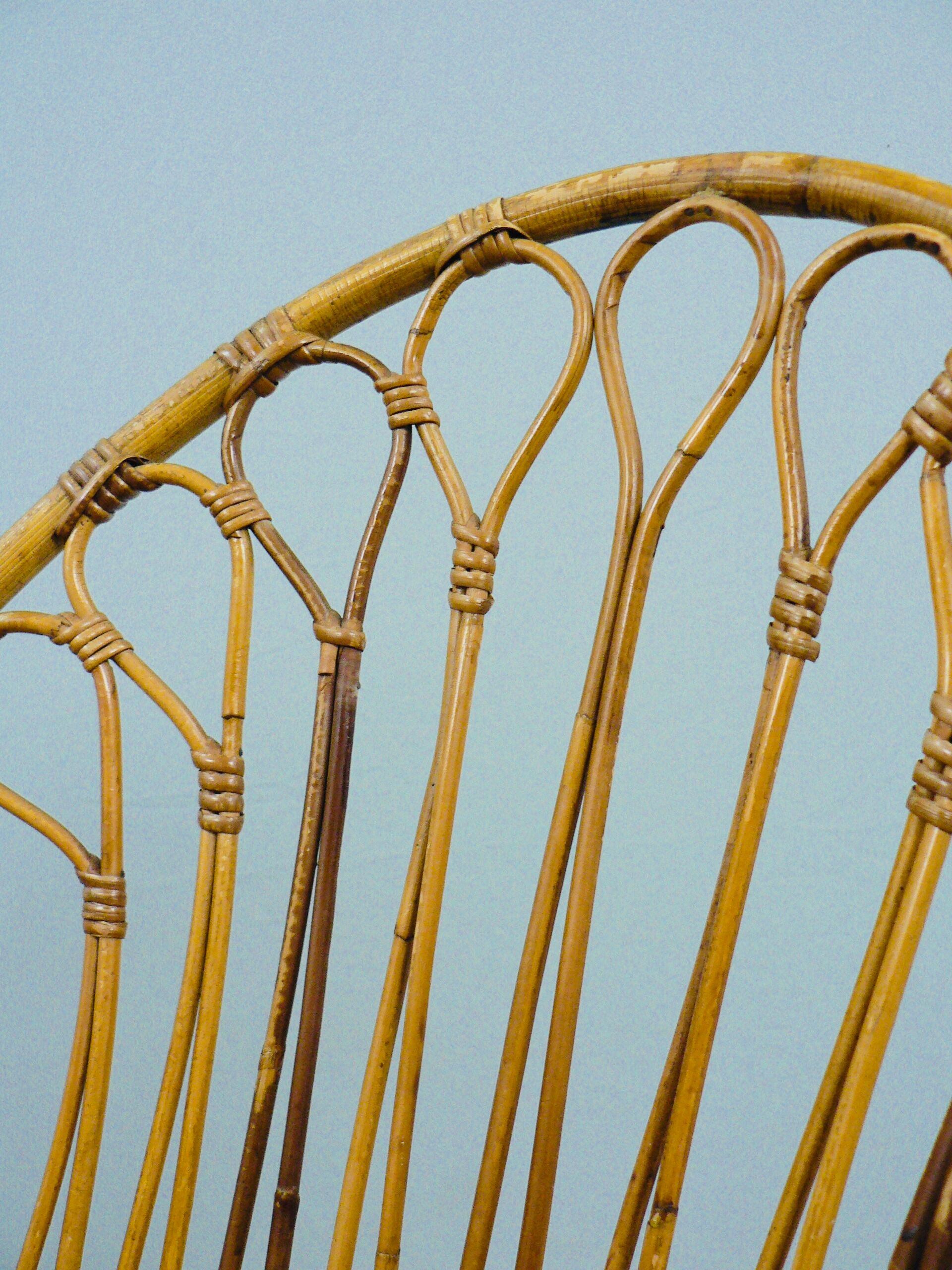 A pair of rattan chairs