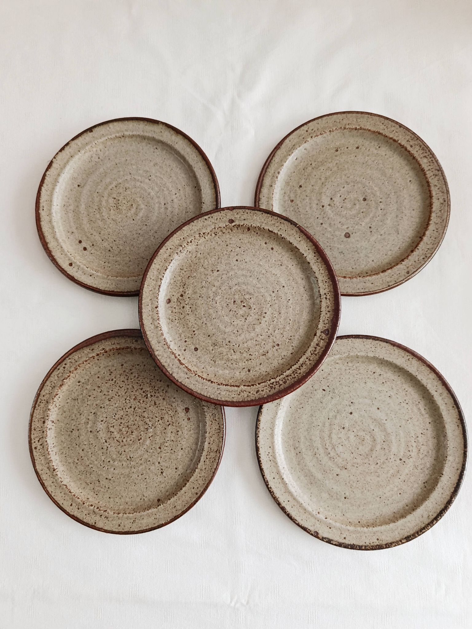Set of 5 dessert plates by Jean Tessier, Le Cep, in pyrite stoneware.