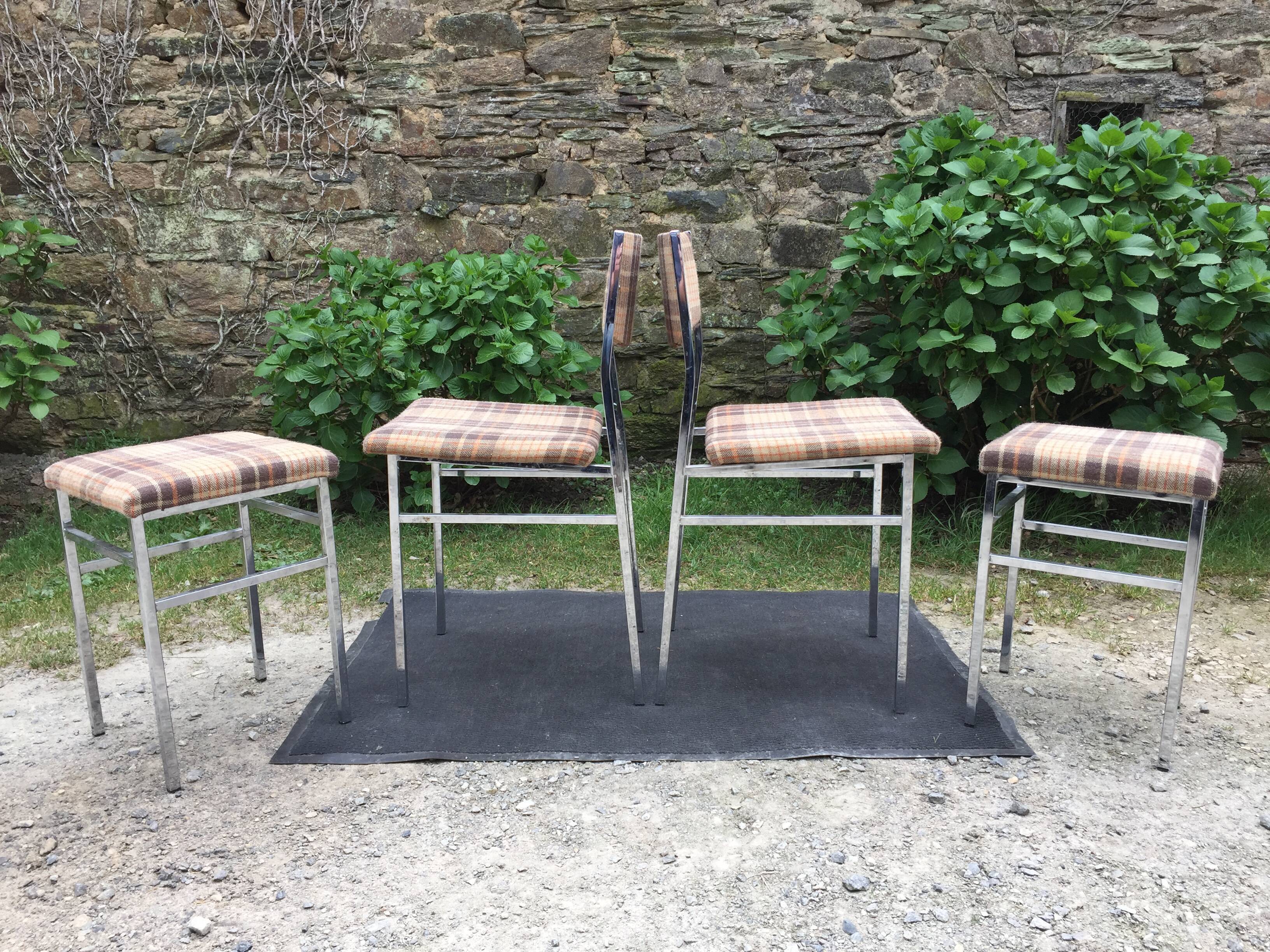 Vintage chairs and stools with chrome-plated square tubular metal base.