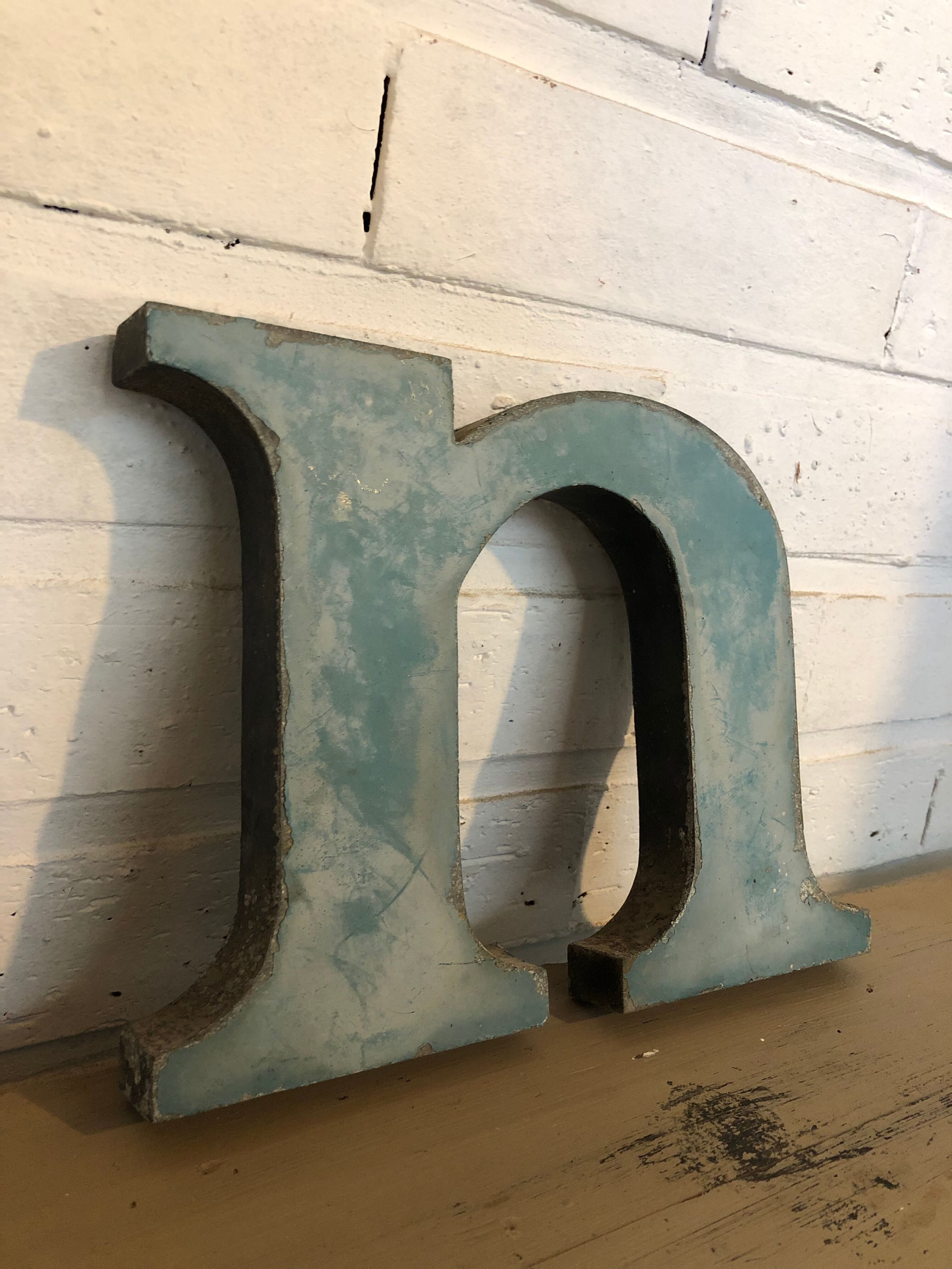 Blue metal letter "N"