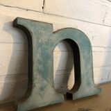 Blue metal letter "N"