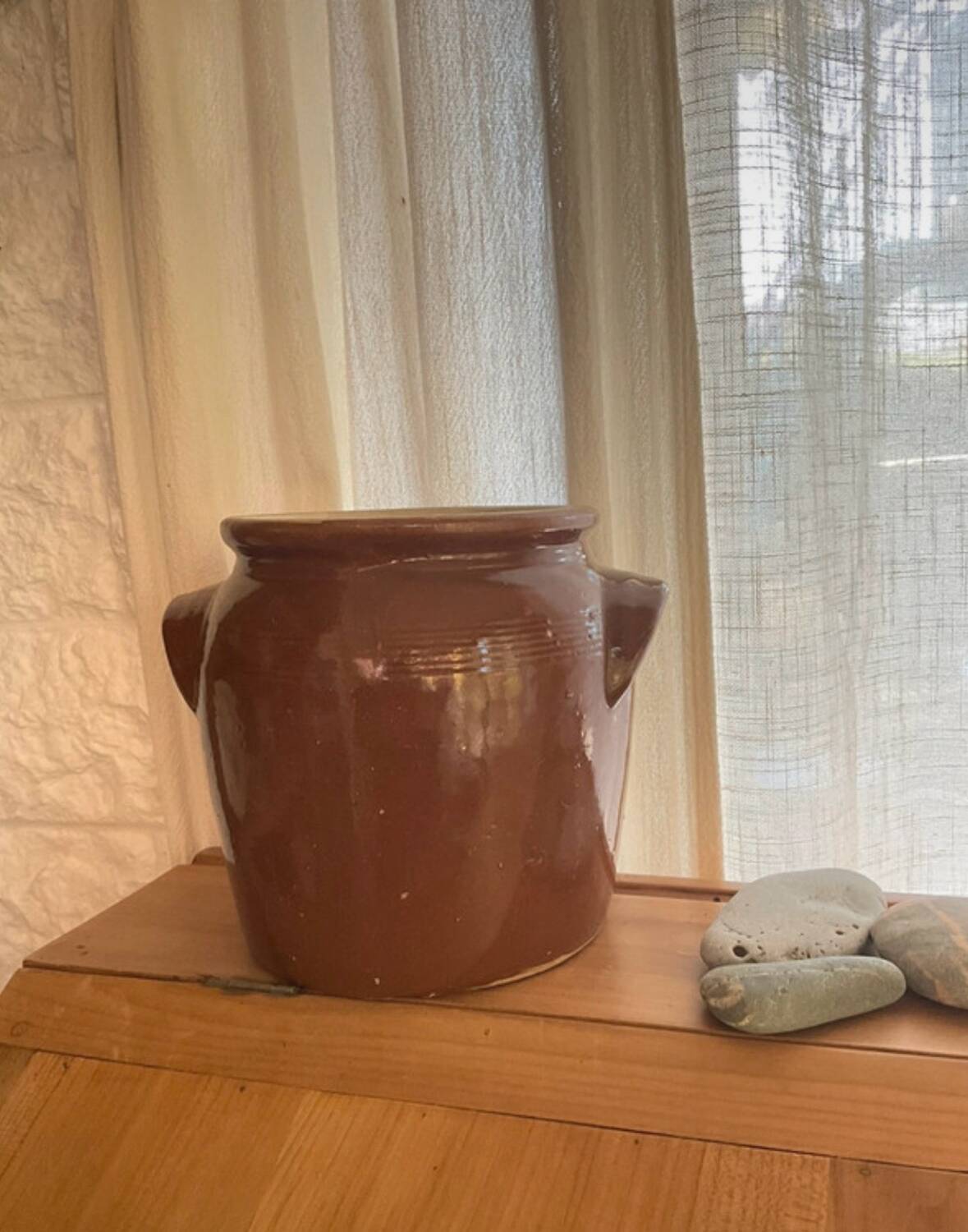 Ancient ceramic salt cellar and its lid.
