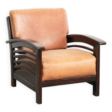 Cognac-coloured cow leather armchair in luxurious Art Deco design