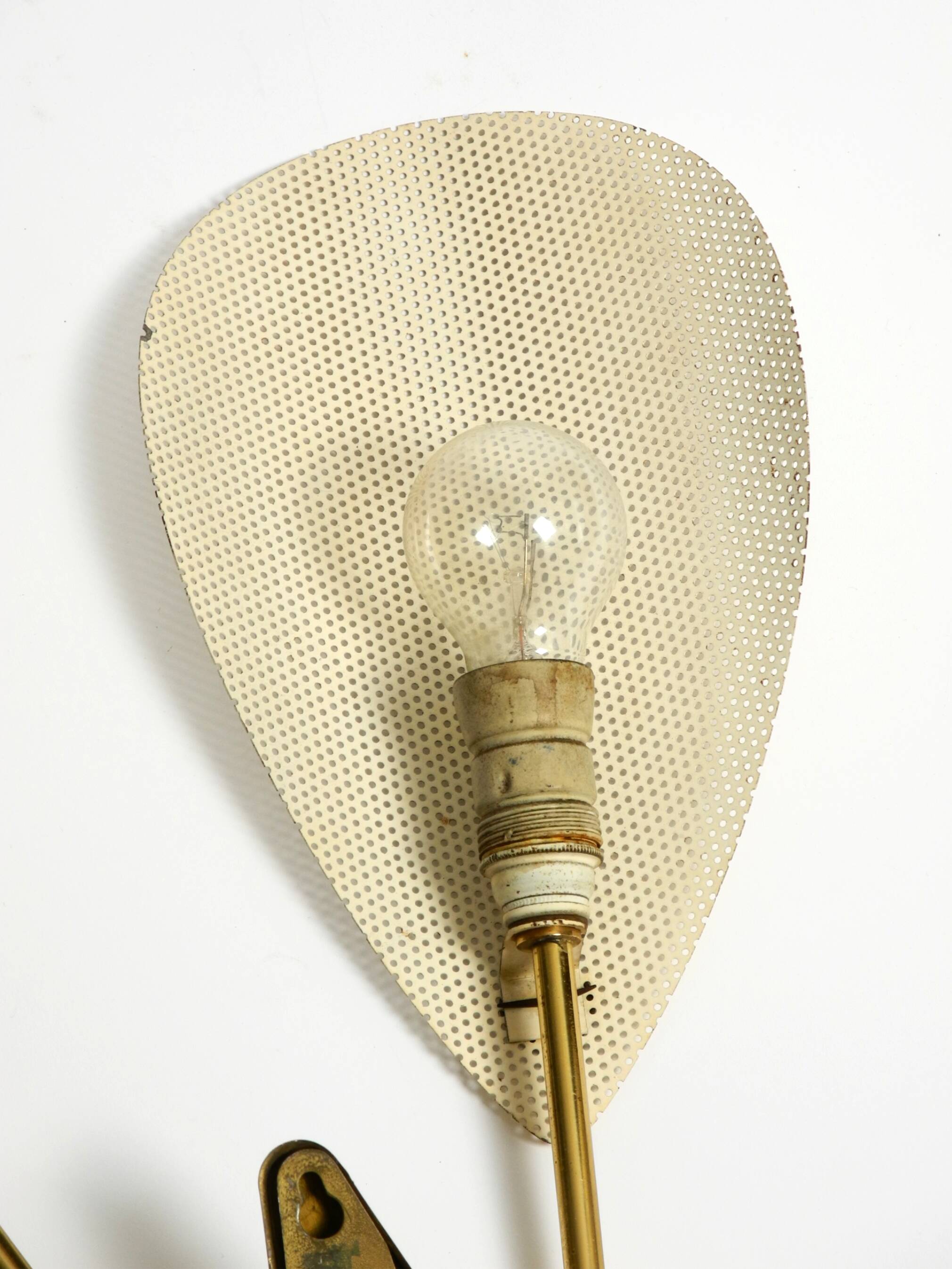 Mid Century Modern brass wall lamp with perforated metal sheet lampshades