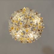 Venetian chandelier in colourless and gold Murano glass, Venini Triedi model, circa 1960.