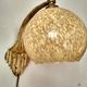 Art deco sconce, golden brass and yellow speckled Clichy glass globe