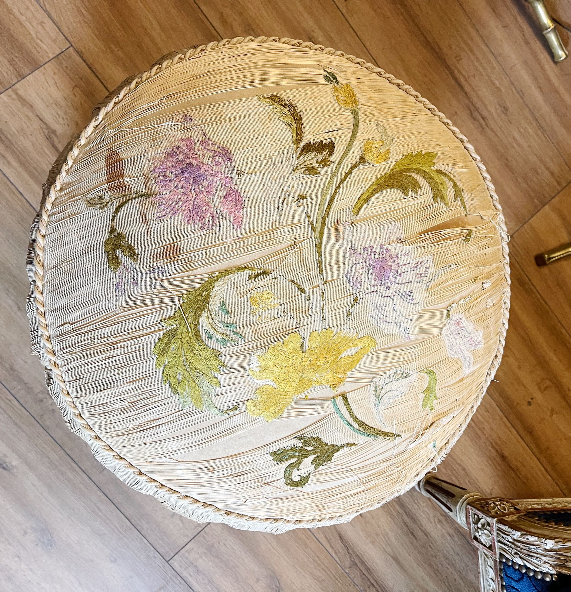 Napoleon III period ottoman in original upworked fabric with wheels
