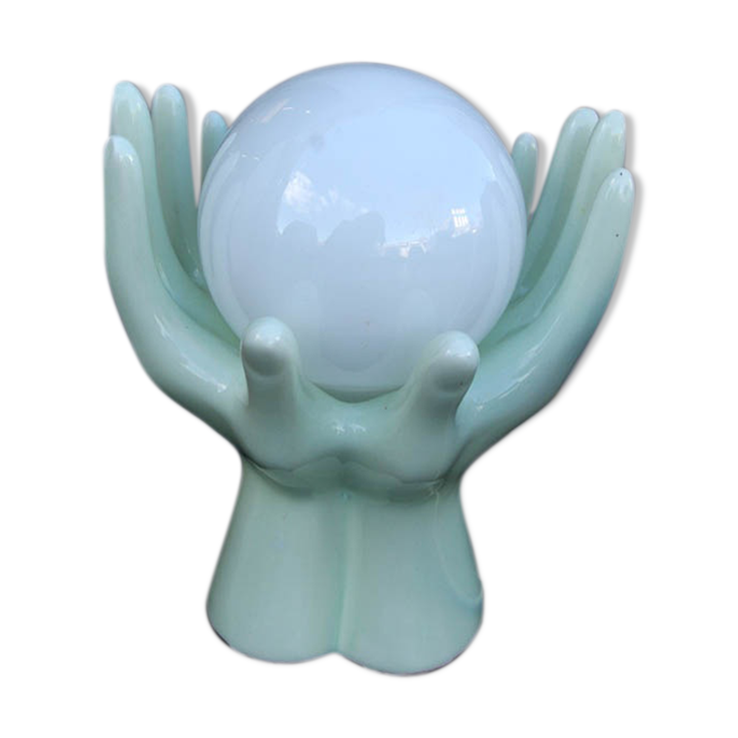 Pale green globe and hands ceramic lamp