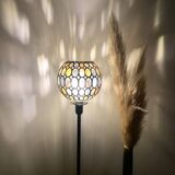 Table lamp with a vintage globe and a black base