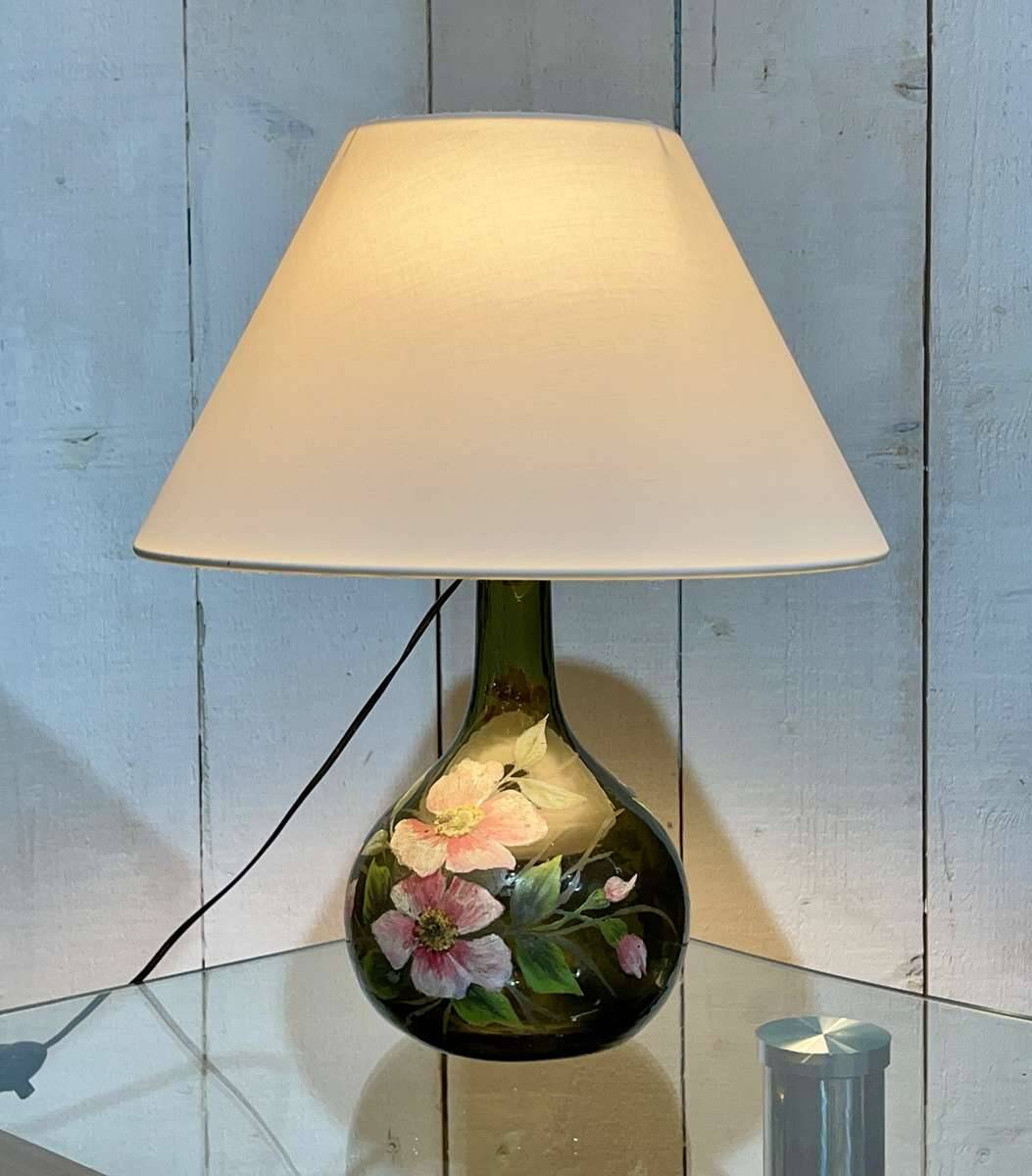 Blown glass lamp painted with a floral design, early 20th century.