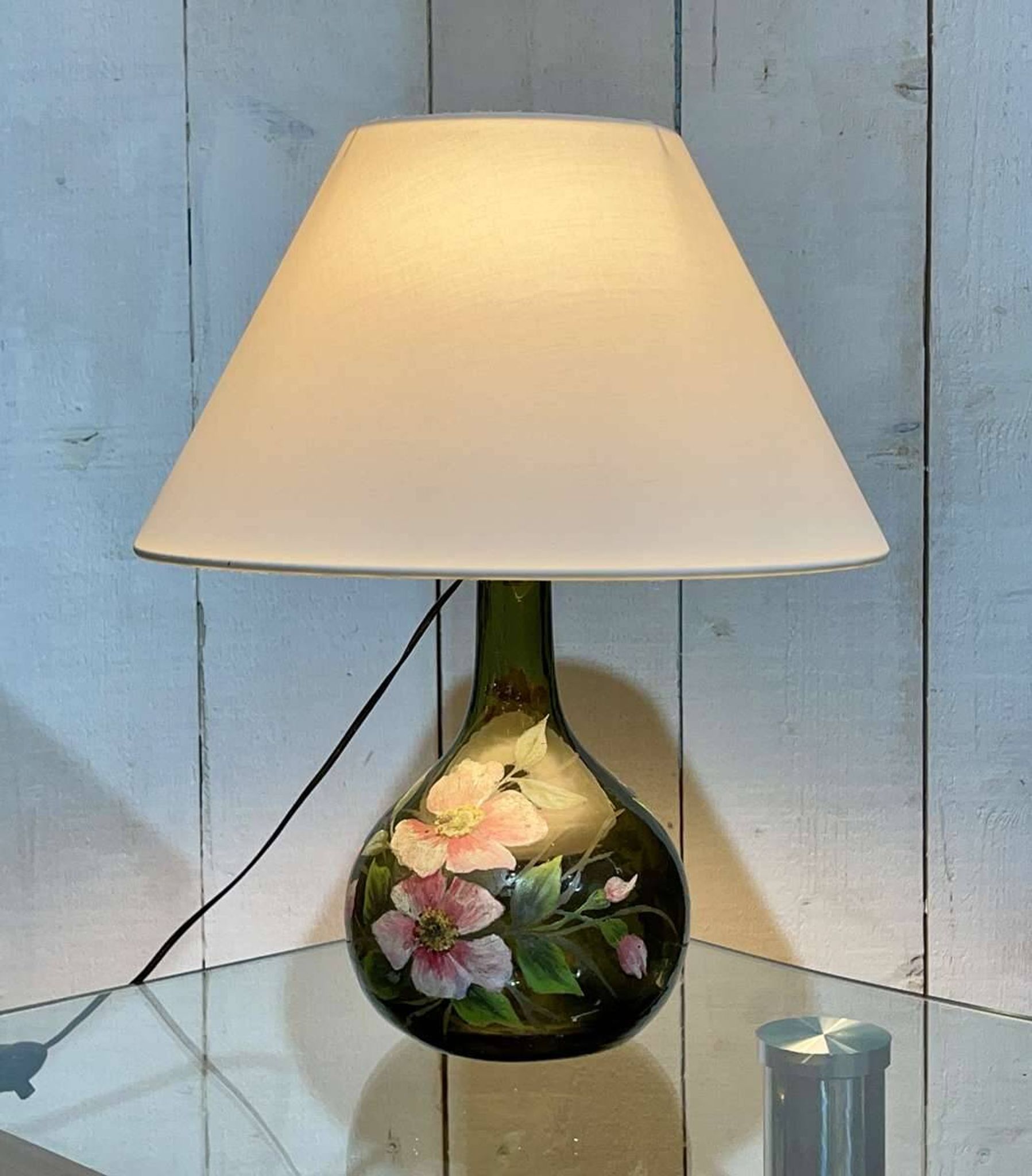 Blown glass lamp painted with a floral design, early 20th century.