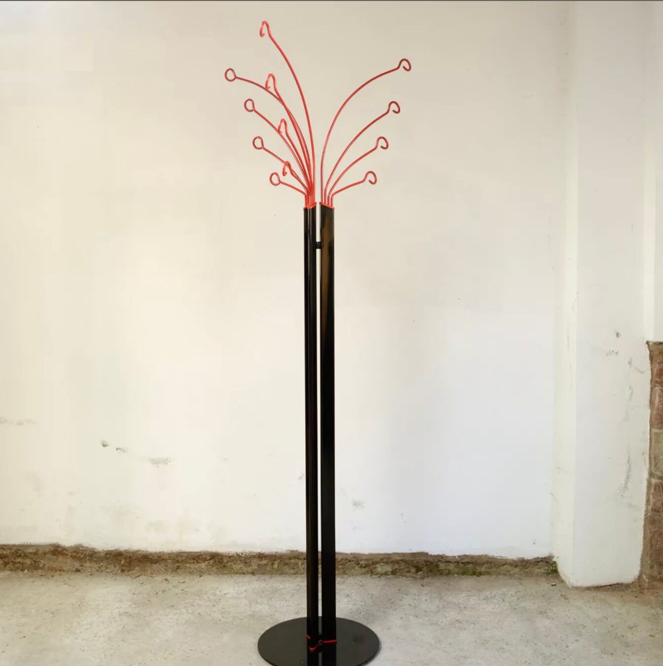 Coat rack on foot metal red and black 12 branches, 80s