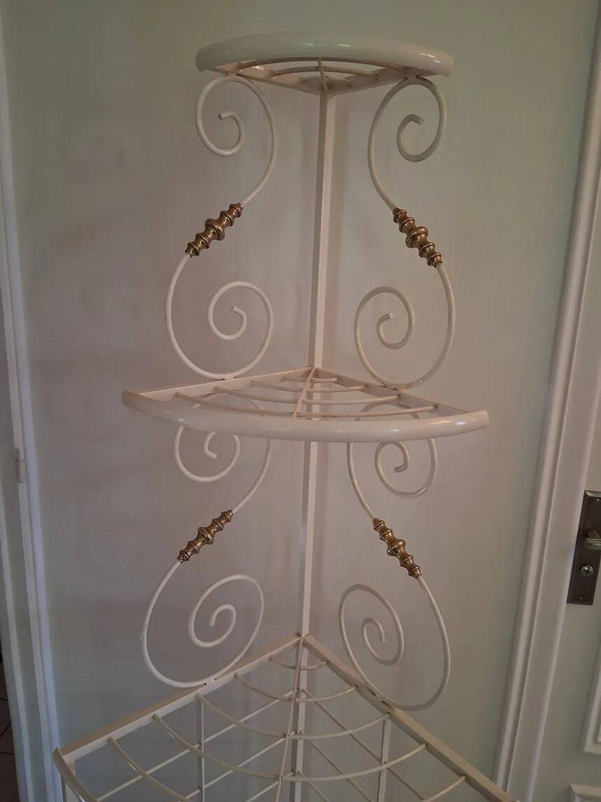Cream and brass corner bakery shelf in wrought iron