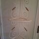 Cream and brass corner bakery shelf in wrought iron