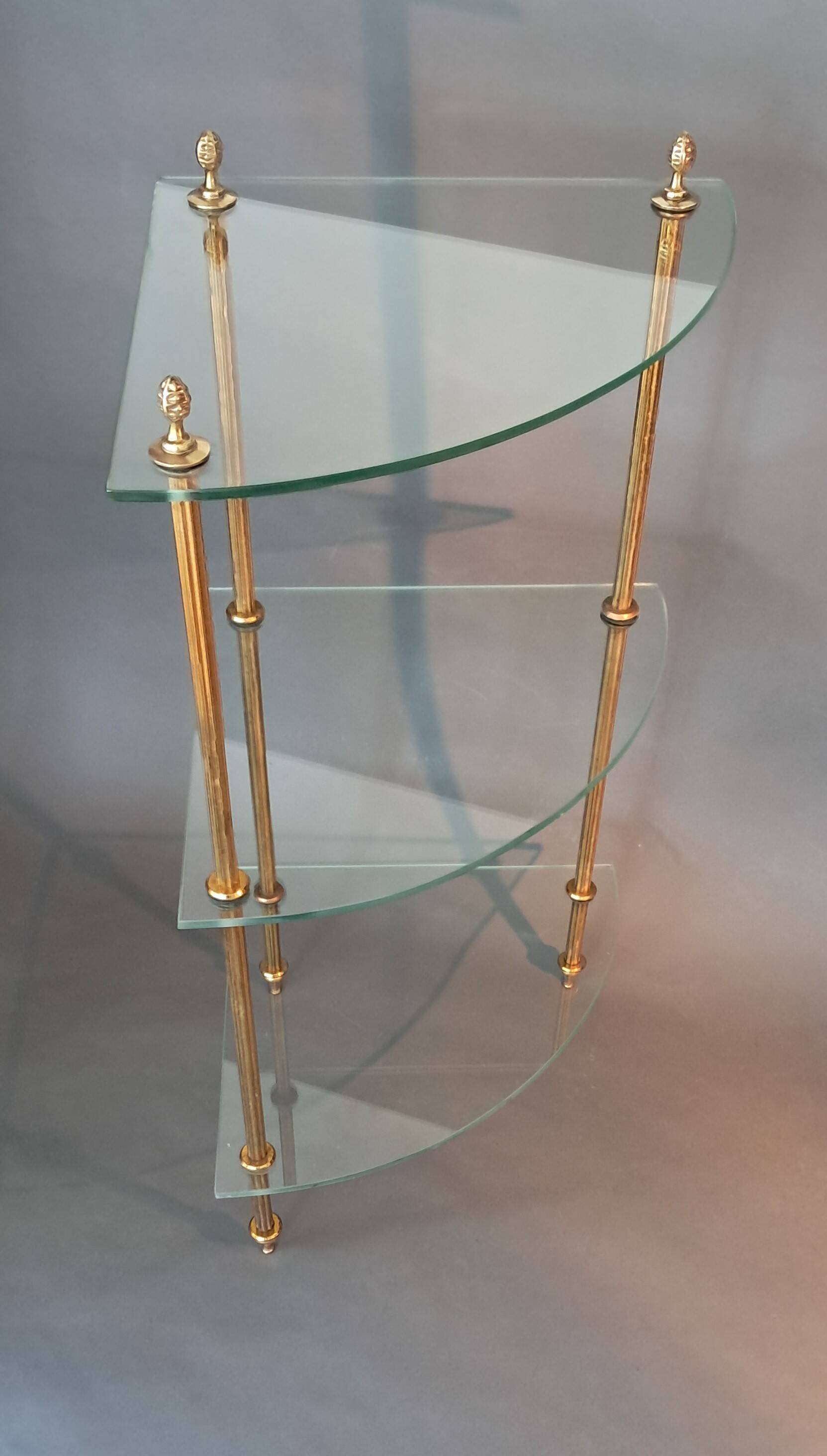 Neoclassical style 3-shelf corner cupboard in gilded brass, Circa 1950/1960.