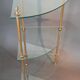 Neoclassical style 3-shelf corner cupboard in gilded brass, Circa 1950/1960.