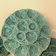 Dish and 4 turquoise faience oyster plates from Gien, France.