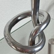 Pair of large aluminium bow candlesticks, Italy, 1970.