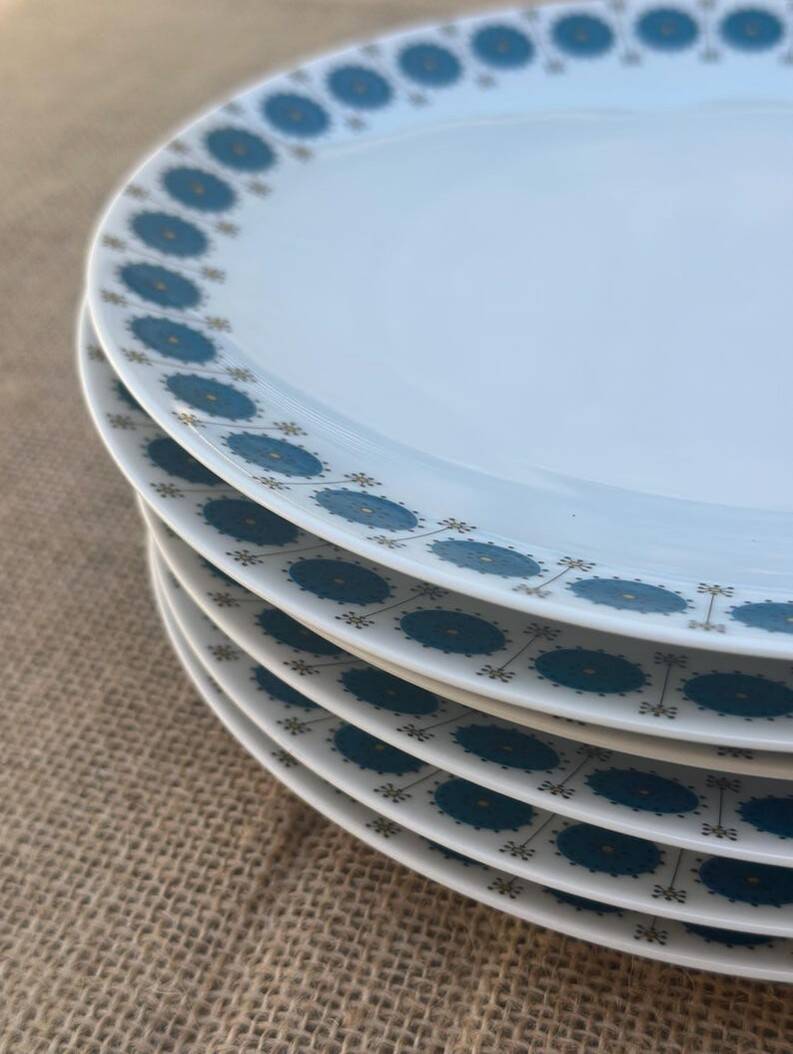 Vintage Thomas Germany flat plates, geometric blue rosette design.