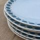 Vintage Thomas Germany flat plates, geometric blue rosette design.