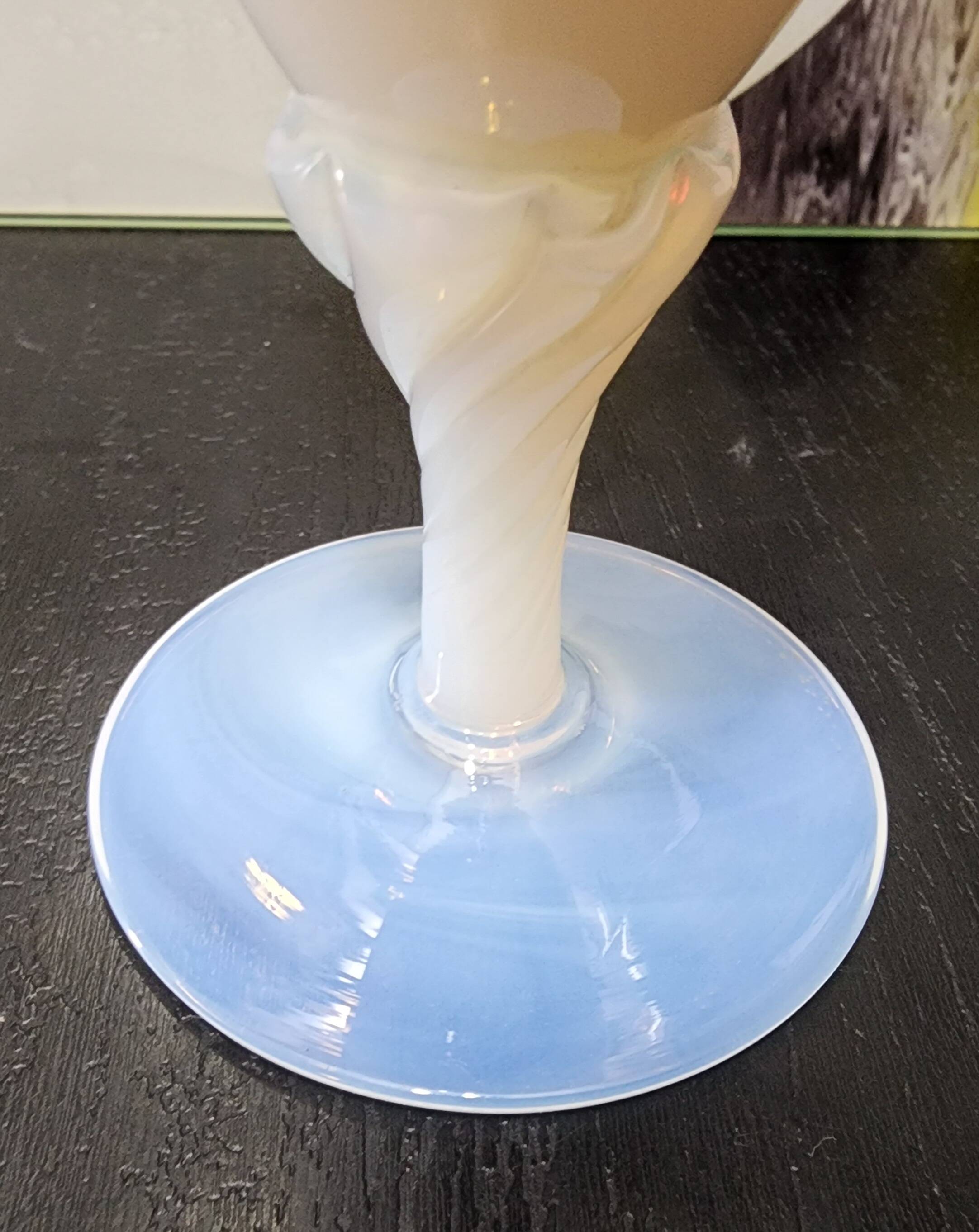 Vintage white opaline soliflore vase with blue reflections and twisted foot.
