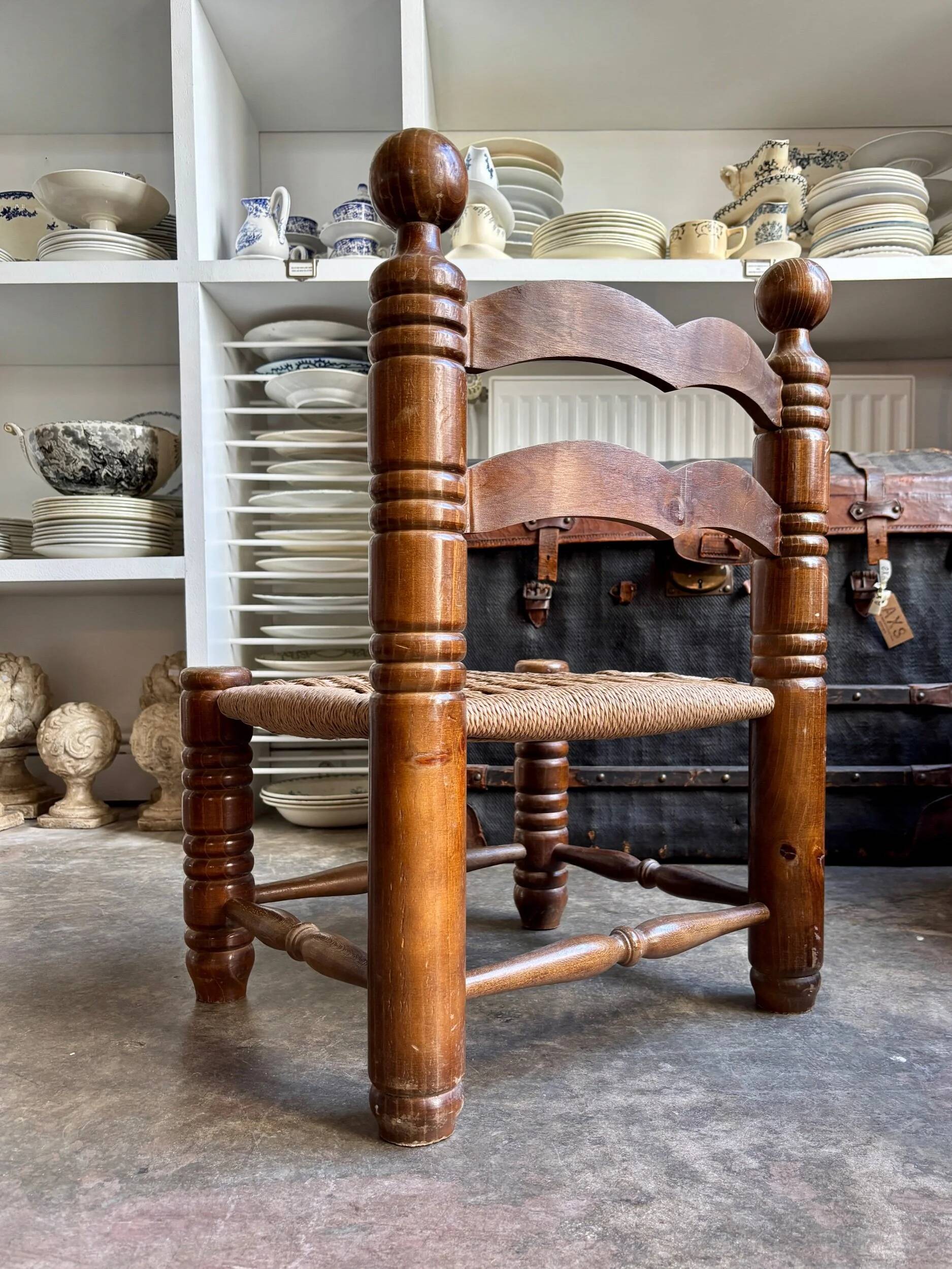 Low chair in dark wood and woven Danish cord attributed to Charles Dudouyt.