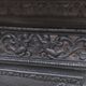 Black cast iron wood burning stove with solid brass handle.