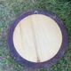 Round varnished wooden mirror