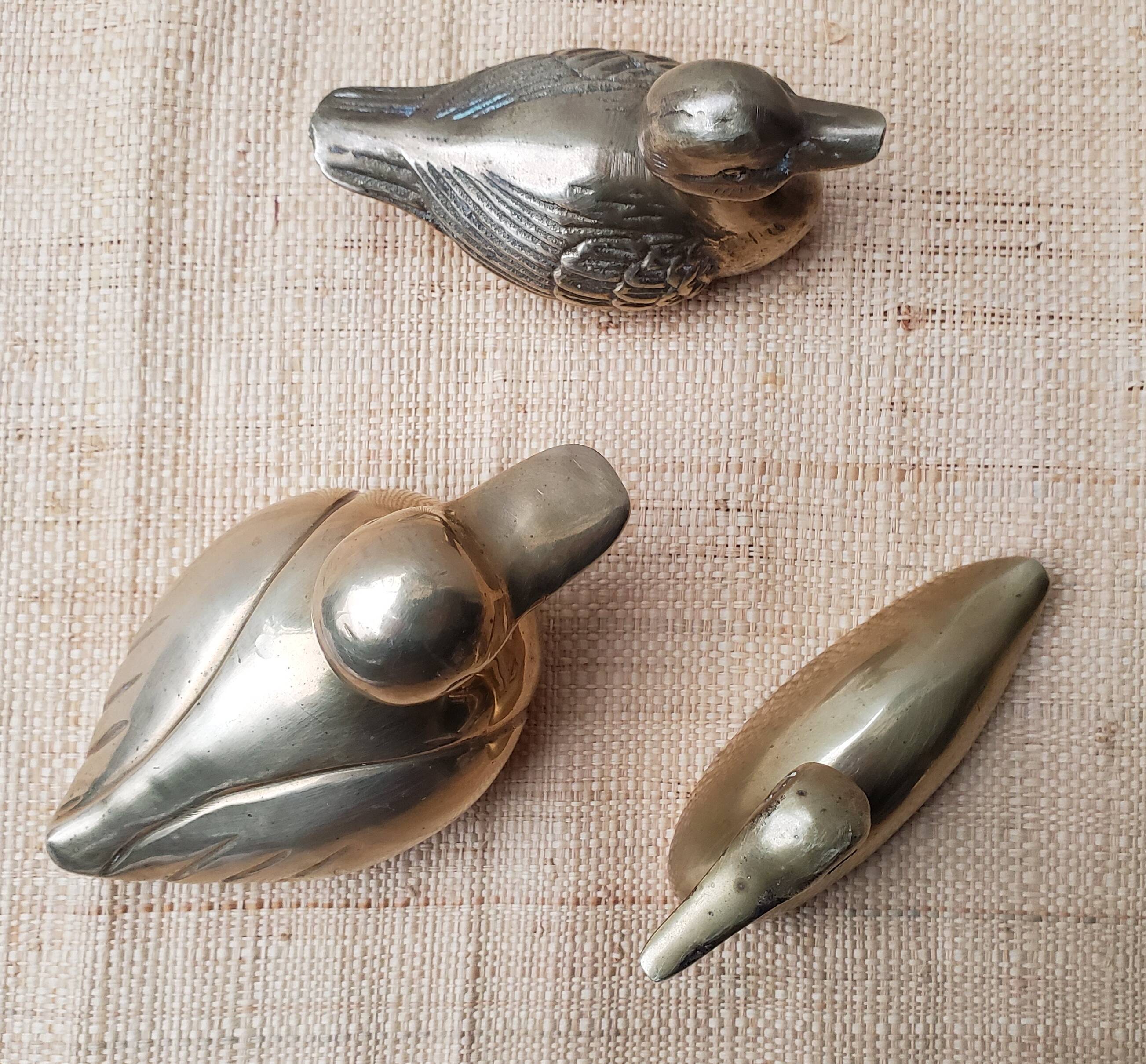 Trio of brass ducks