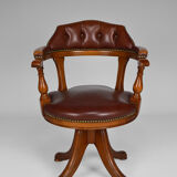 Swivel Chesterfield armchair in wood and leather