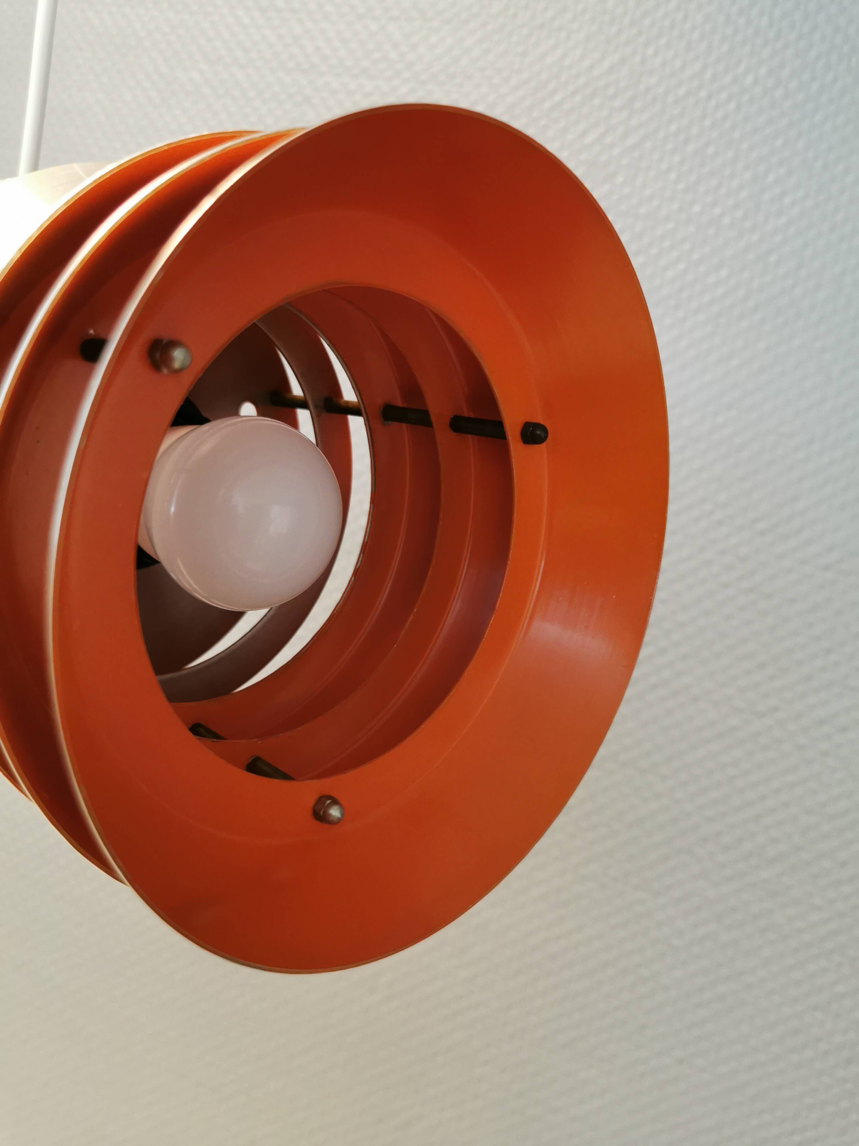 Danish/Swedish hanging lamp, in silver-coloured aluminium with orange interior paint.