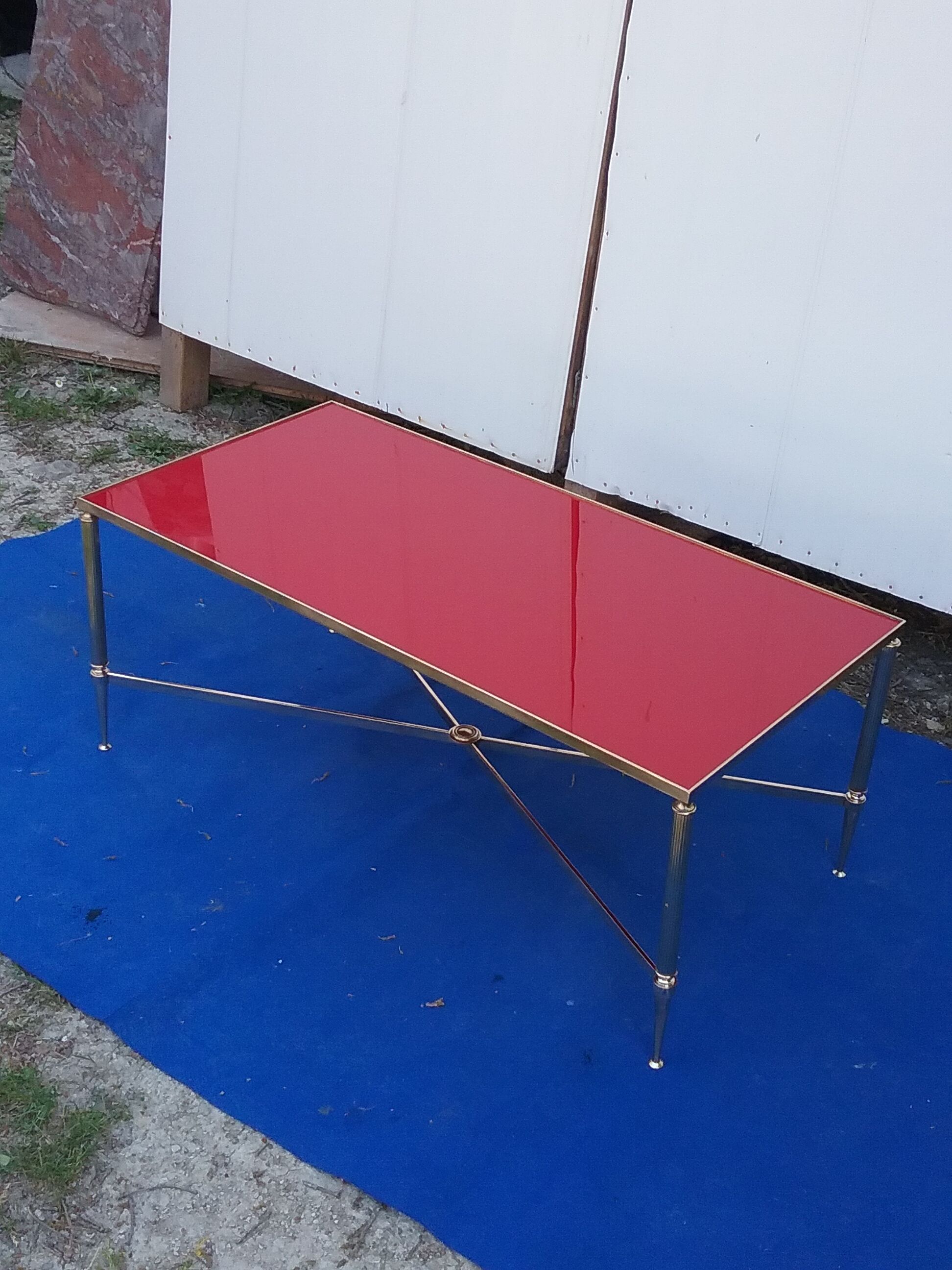 Brass coffee table with red glass top