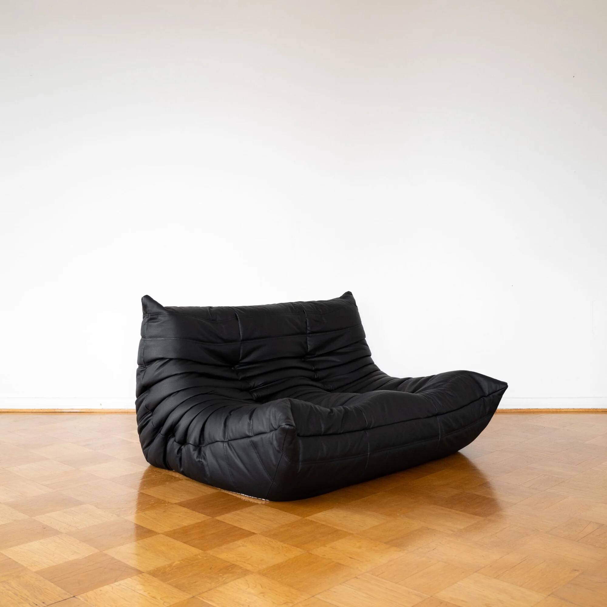 Black leather 2-seater Togo sofa by Michel Ducaroy