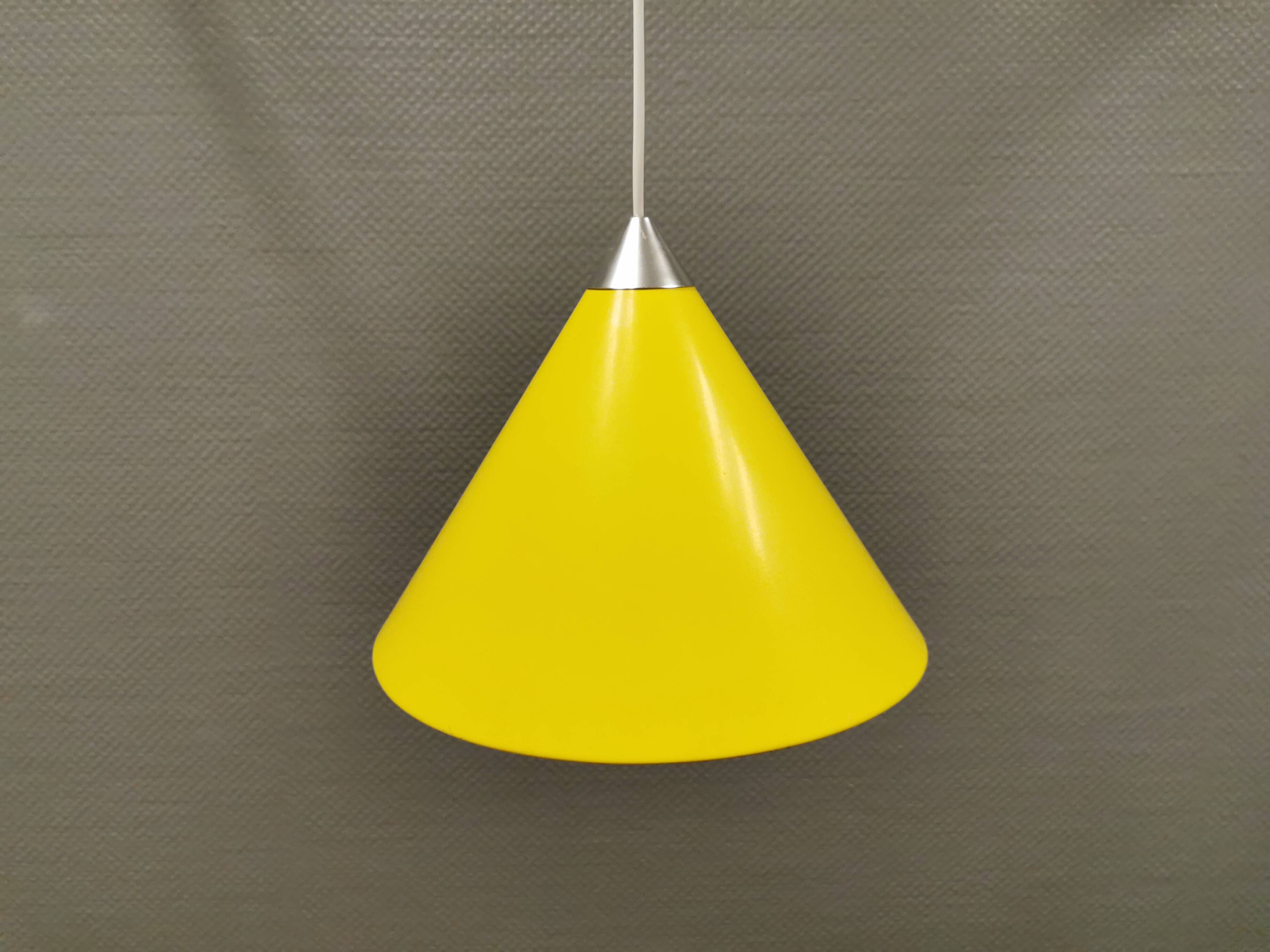 Small cone-shaped lamp in beautiful yellow lacquer finish.