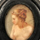 Miniature on medallion porcelain, blackened wooden frame