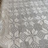 White cotton bedspread, crocheted sofa throw with star patterns