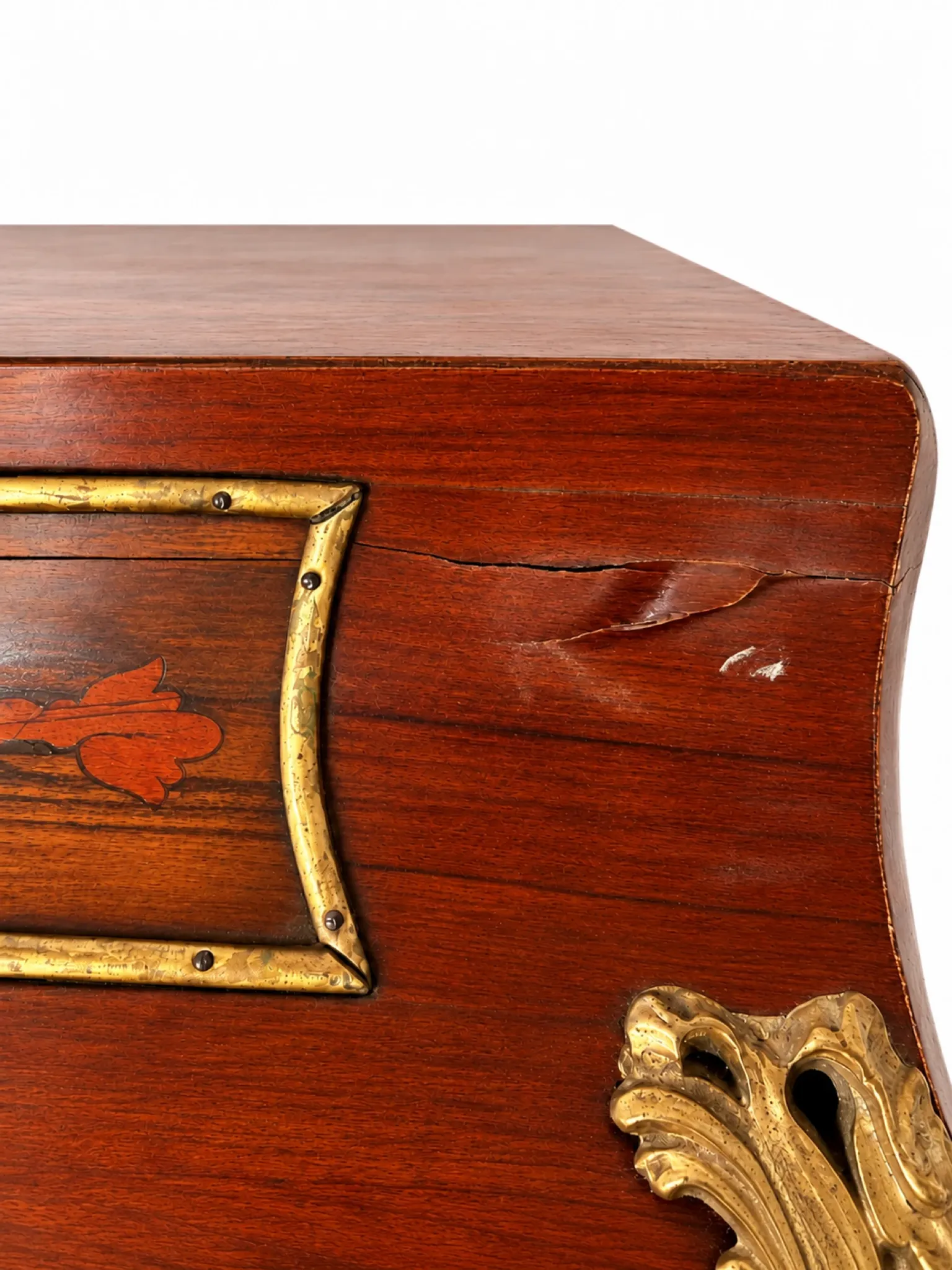 Louis XV cylinder desk with floral marquetry and gilded ornaments.