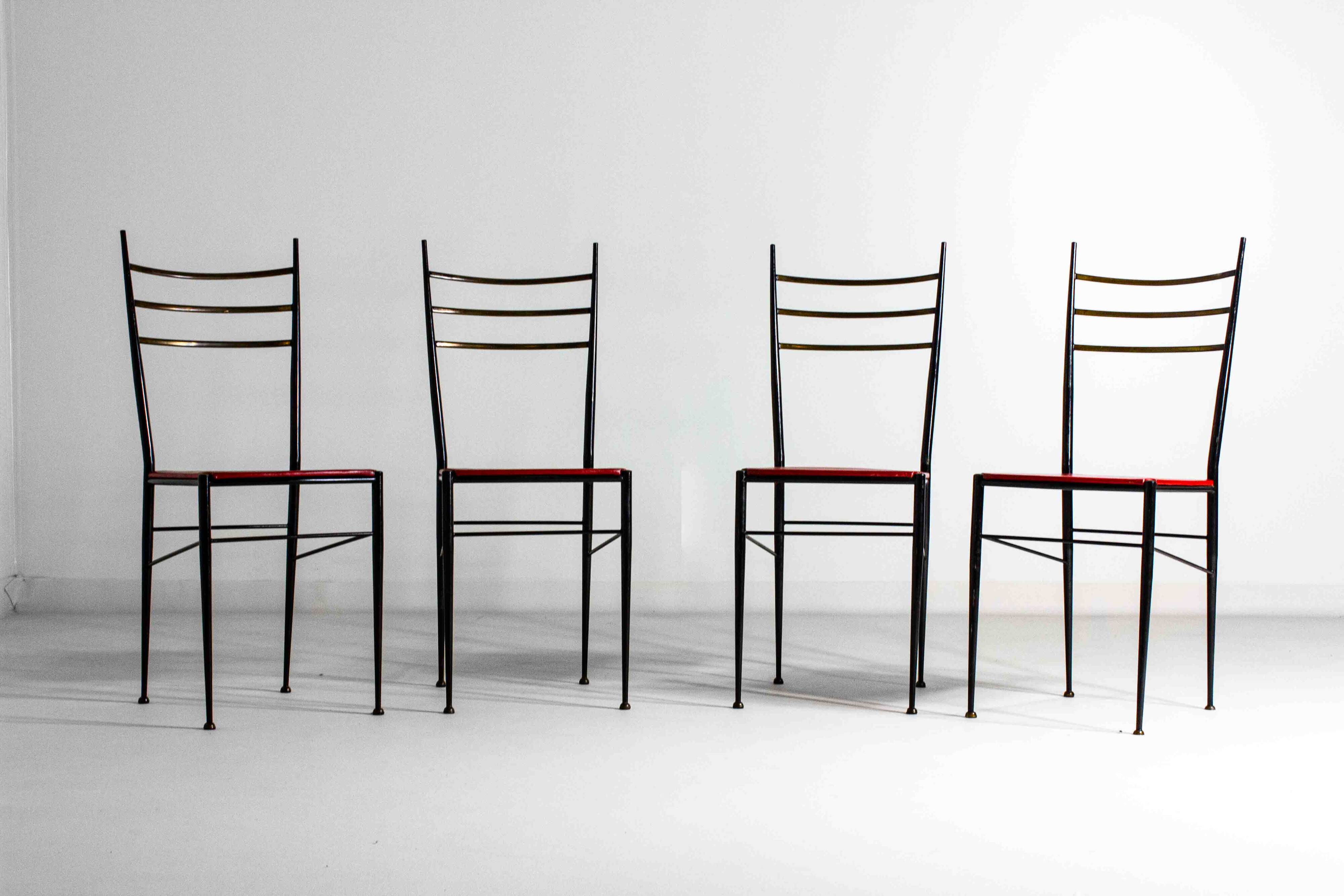 Fine set of metal dining chairs with red leather seating, Italy 1970s