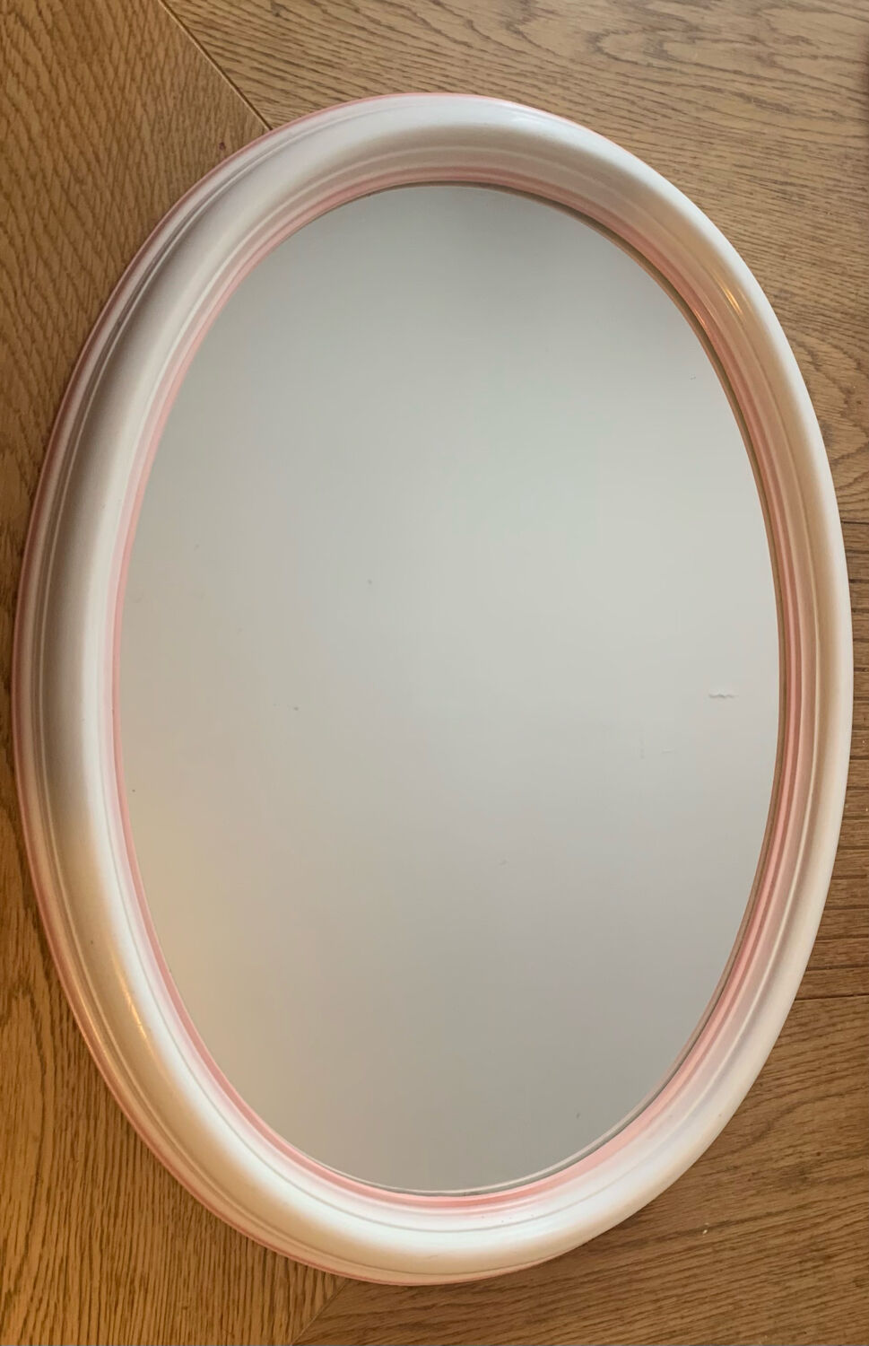 Pink oval mirror
