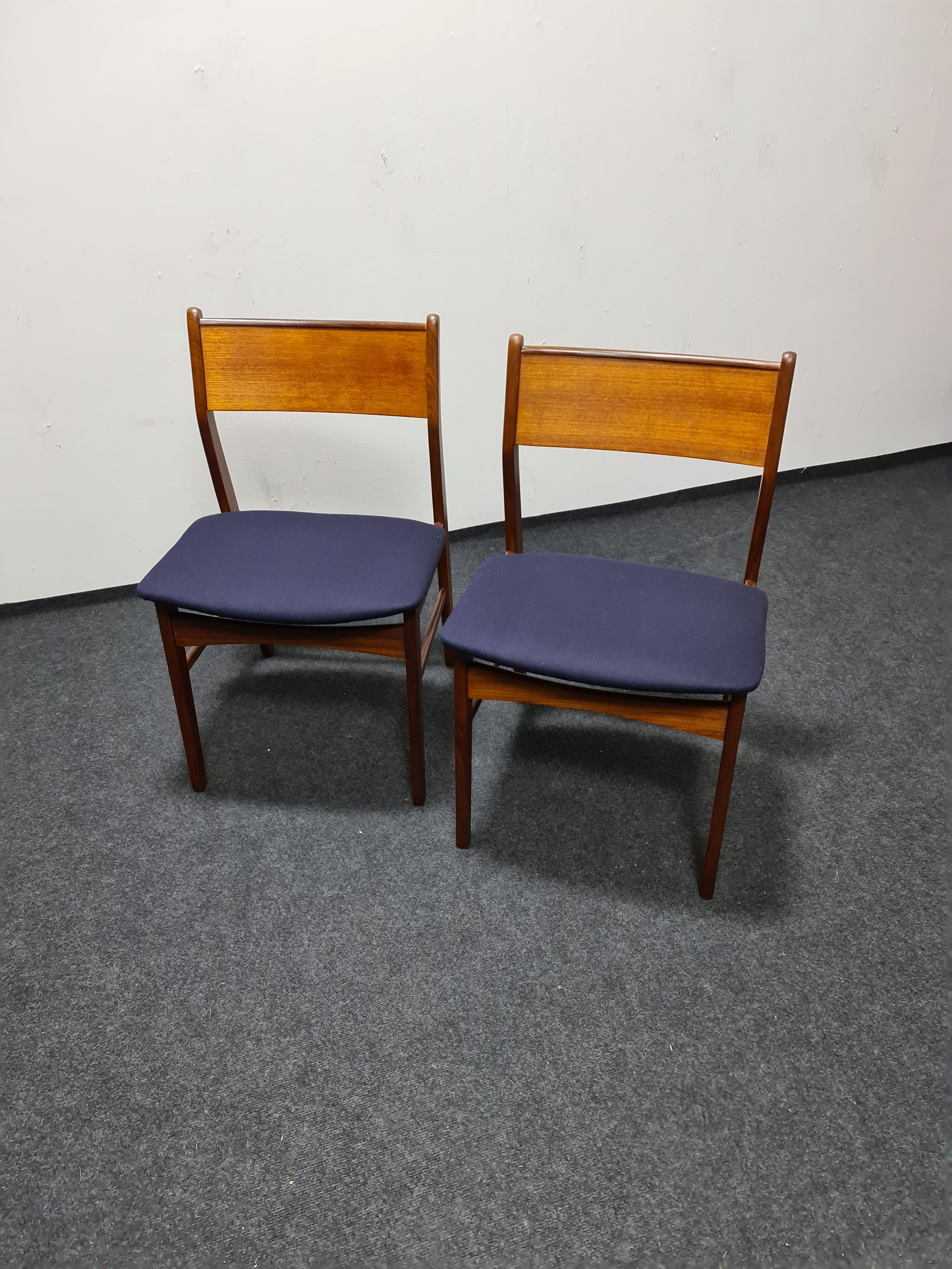 A pair of vintage teak dinning chairs