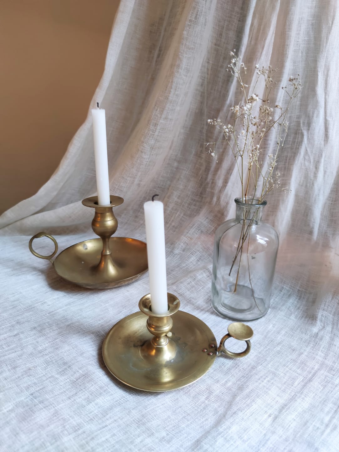 Large hand candlestick in gilded brass