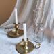 Large hand candlestick in gilded brass
