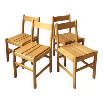 4 wooden chairs in the Charlotte Perriand style