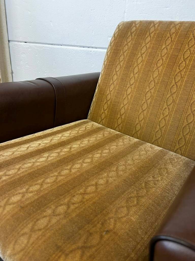 Vintage brown / ochre armchair / a chair on wheels