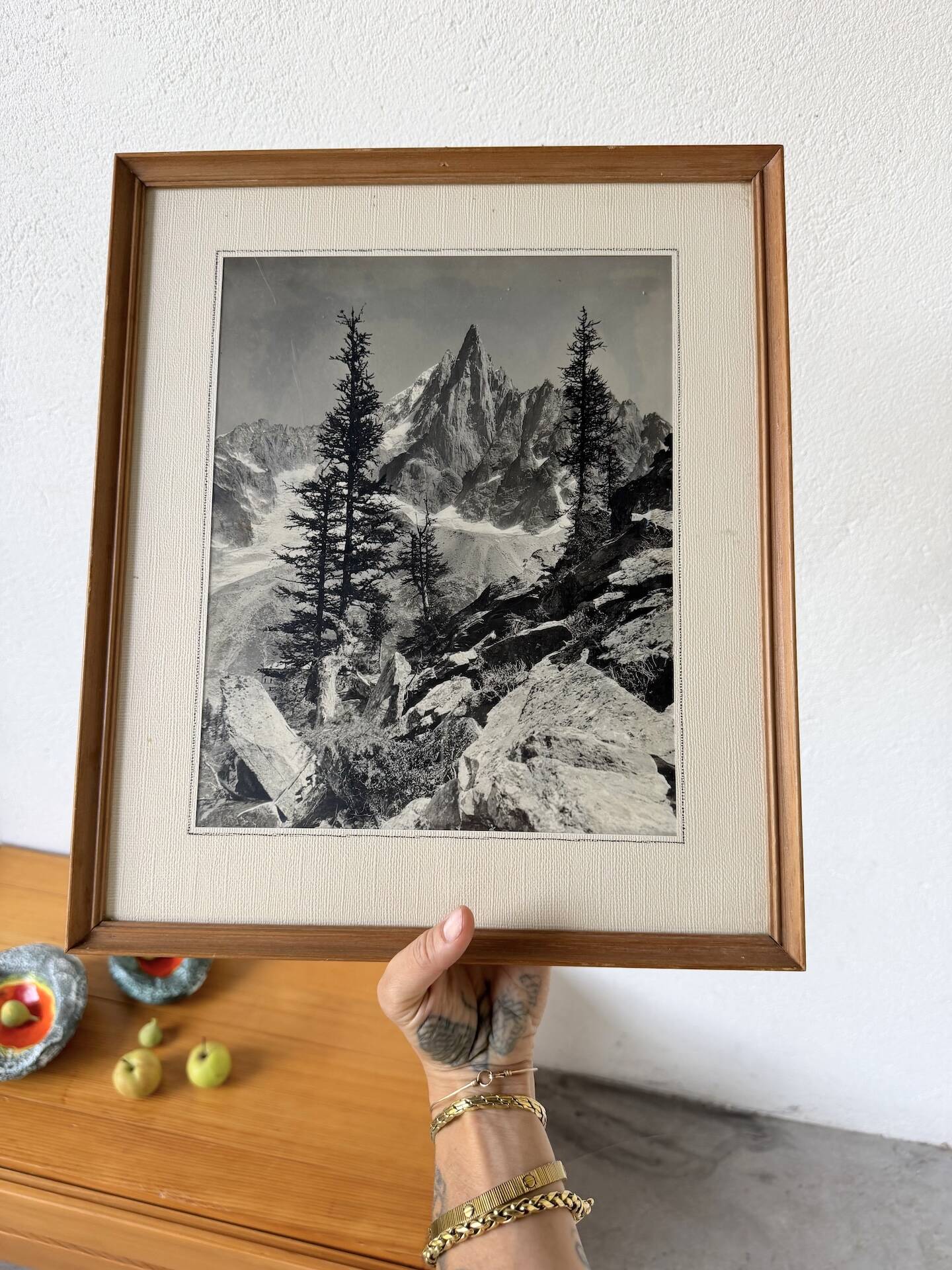 Framed old photo of a mountain landscape.