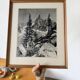 Framed old photo of a mountain landscape.