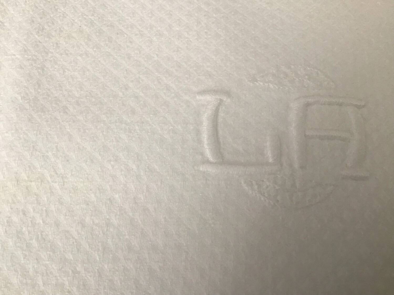 12 white damask napkins with LA monogram