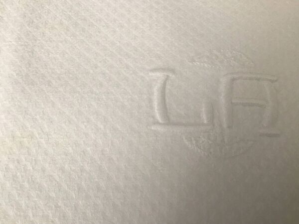 12 serviettes en damassé blanc au monogramme LA
