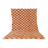 Orange checkered rug made entirely by hand