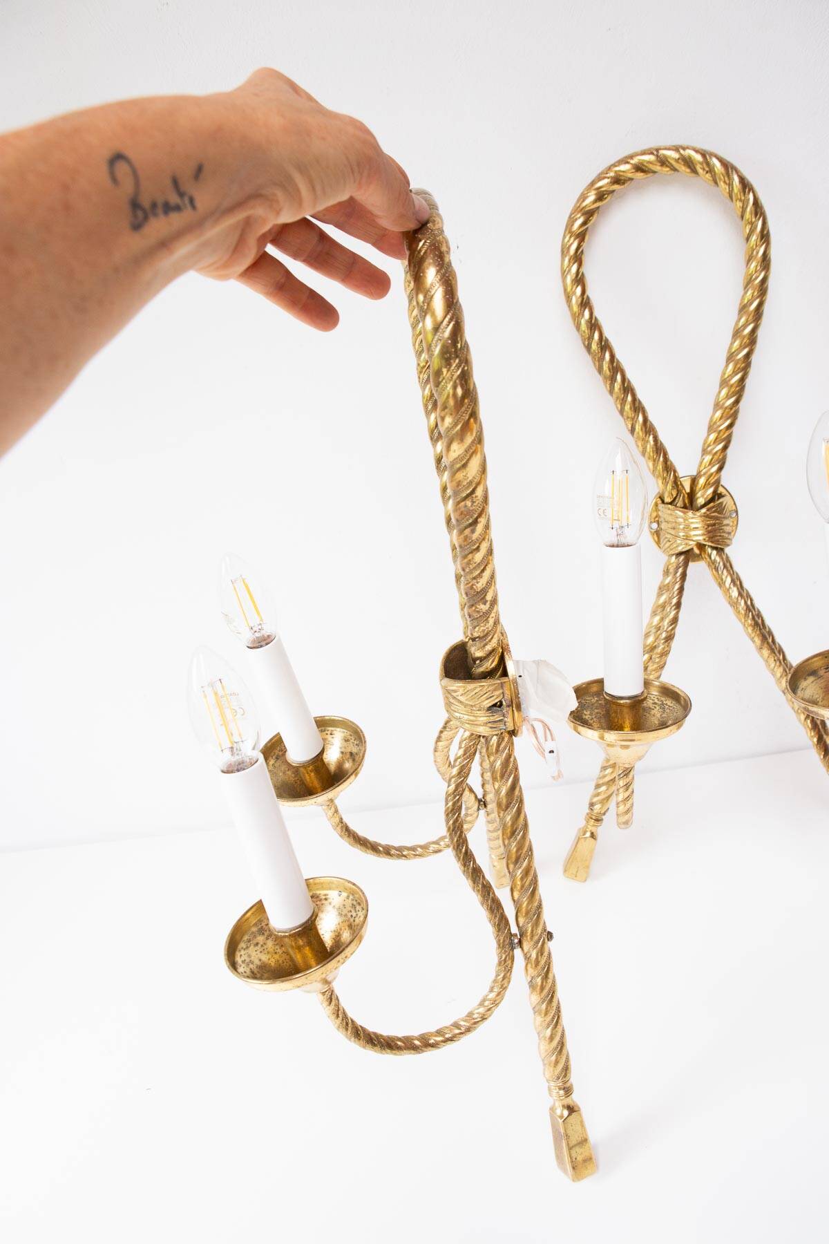 Pair of large gilded brass Noeud wall lights